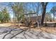 Inviting backyard featuring a charming wooden swing set, offering a relaxing outdoor space at 7516 Mourning Dove Dr, Sanford, NC 27332