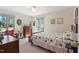 Cozy bedroom featuring wood furniture, bright natural light, and tranquil decor, perfect for relaxation at 7516 Mourning Dove Dr, Sanford, NC 27332