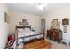 Inviting bedroom with flamingo themed bedding, wooden furniture, and classic design, offering a cozy retreat at 7516 Mourning Dove Dr, Sanford, NC 27332