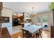 Open-concept dining area flows into the kitchen and outdoor deck at 7516 Mourning Dove Dr, Sanford, NC 27332