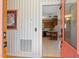 Open entryway with a view into the kitchen featuring wooden cabinets and a tiled floor at 7516 Mourning Dove Dr, Sanford, NC 27332