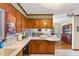 Kitchen view showcasing the breakfast bar and dining area at 7516 Mourning Dove Dr, Sanford, NC 27332