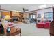 Cozy living room features brick fireplace and comfortable seating at 7516 Mourning Dove Dr, Sanford, NC 27332