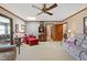 Spacious living room featuring a skylight, wood trim and access to other rooms at 7516 Mourning Dove Dr, Sanford, NC 27332