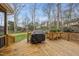 Large back deck with a grill, overlooking a backyard with space for entertaining and recreation at 8304 Circlewood Ct, Raleigh, NC 27615