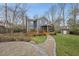 Charming two-story home with a wooden deck and screened porch leading to a lush backyard at 8304 Circlewood Ct, Raleigh, NC 27615