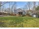 Large backyard featuring a wood deck, screened in porch, and storage shed at 8304 Circlewood Ct, Raleigh, NC 27615