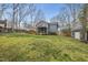 Large backyard features a wood deck, screened in porch, and storage shed at 8304 Circlewood Ct, Raleigh, NC 27615