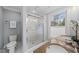 Bright bathroom featuring double sinks, granite countertop, and glass shower, perfect for a modern home at 8304 Circlewood Ct, Raleigh, NC 27615