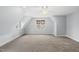 Large bedroom with carpet, vaulted ceilings and multiple windows offering ample natural light at 8304 Circlewood Ct, Raleigh, NC 27615