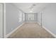 Neutral toned bedroom featuring carpet floors and natural light perfect for relaxation at 8304 Circlewood Ct, Raleigh, NC 27615