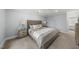 Well-lit bedroom with neutral decor, carpet, and ceiling fan at 8304 Circlewood Ct, Raleigh, NC 27615