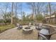 Outdoor firepit area with stone pavers and seating, creating a cozy backyard retreat at 8304 Circlewood Ct, Raleigh, NC 27615