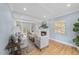 Bright living room with fireplace, built-in shelves, and hardwood flooring at 8304 Circlewood Ct, Raleigh, NC 27615