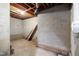 Unfinished basement with exposed brick and pipes, waiting for renovation at 100 Dunedin Ct, Cary, NC 27511