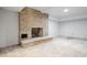 Unfinished basement with a large brick fireplace awaiting customization at 100 Dunedin Ct, Cary, NC 27511