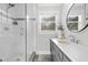 Modern bathroom featuring a glass shower, updated vanity, and natural light at 100 Dunedin Ct, Cary, NC 27511