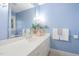 Bathroom with a large mirror over a white vanity, complemented by fresh towels and bright lighting at 100 Dunedin Ct, Cary, NC 27511