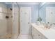 Bright bathroom boasts a glass-enclosed shower and sleek vanity with marble countertops at 100 Dunedin Ct, Cary, NC 27511