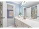 This stylish bathroom features an updated shower, sink, and vanity and includes a connecting room at 100 Dunedin Ct, Cary, NC 27511