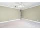 Large bedroom featuring a ceiling fan and ample natural light at 100 Dunedin Ct, Cary, NC 27511