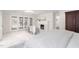 Bright bedroom featuring a fireplace, French doors and sitting area at 100 Dunedin Ct, Cary, NC 27511