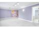 A playful accent wall adds a unique touch to this spacious bedroom at 100 Dunedin Ct, Cary, NC 27511