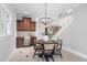 Charming dining area with a study nook and a staircase leading to the upper level at 100 Dunedin Ct, Cary, NC 27511