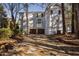 Rear exterior of home with two-car garage and brick chimney at 100 Dunedin Ct, Cary, NC 27511