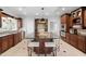 Modern kitchen with granite countertops, custom wood cabinets, stainless steel appliances, and a large center island at 100 Dunedin Ct, Cary, NC 27511