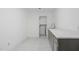 The laundry room is equipped with modern appliances and stylish tile flooring at 100 Dunedin Ct, Cary, NC 27511