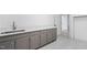 This laundry room features stylish flooring and a modern countertop with sink at 100 Dunedin Ct, Cary, NC 27511