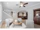 Open living space with a staircase, kitchen view, and comfortable seating arrangement at 100 Dunedin Ct, Cary, NC 27511