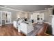 Inviting living room with hardwood floors, fireplace, and seamless flow to the foyer and staircase at 100 Dunedin Ct, Cary, NC 27511