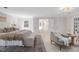 Bright and airy main bedroom leading to a bathroom, offering a tranquil retreat with ample space at 100 Dunedin Ct, Cary, NC 27511