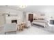 Spacious main bedroom featuring a fireplace, sitting area, and a comfortable king-size bed at 100 Dunedin Ct, Cary, NC 27511