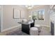 Bright office space featuring a fireplace, large windows, and neutral tones at 100 Dunedin Ct, Cary, NC 27511