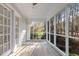 Relaxing screened porch with beautiful views of the landscaped backyard at 100 Dunedin Ct, Cary, NC 27511