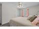 Comfortable bedroom features a ceiling fan, a window with curtains, and a closet with double doors at 1004 Plateau Ln, Raleigh, NC 27615