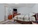 Comfortable bedroom with large window and wood furnishings at 1004 Plateau Ln, Raleigh, NC 27615