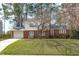 Charming two-story brick home with well-maintained lawn and attached garage at 1004 Plateau Ln, Raleigh, NC 27615