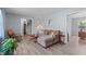 Inviting living room featuring hardwood floors, comfortable seating, and easy access to staircase at 1004 Plateau Ln, Raleigh, NC 27615