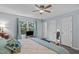 Large main bedroom with ceiling fan, window with curtains, and storage at 1004 Plateau Ln, Raleigh, NC 27615