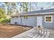 Home backyard featuring a patio, mulched area, and stepping stone path at 101 Newell St, Durham, NC 27705