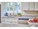 Sunlit kitchen showcasing stainless steel appliances, granite counters, and a view of the outdoors at 101 Newell St, Durham, NC 27705