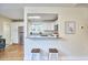 Bright kitchen with a breakfast bar, stainless steel appliances, and stylish white cabinetry at 101 Newell St, Durham, NC 27705