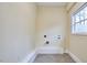 Bright laundry room with utility connections and a window at 101 Newell St, Durham, NC 27705