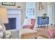Living room with cozy seating, decorative fireplace, and stylish furnishings at 101 Newell St, Durham, NC 27705