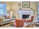 Bright living room with a fireplace, comfortable seating, and stylish decor at 101 Newell St, Durham, NC 27705
