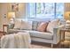 Comfortable living room featuring a couch adorned with decorative pillows and an outdoor view at 101 Newell St, Durham, NC 27705